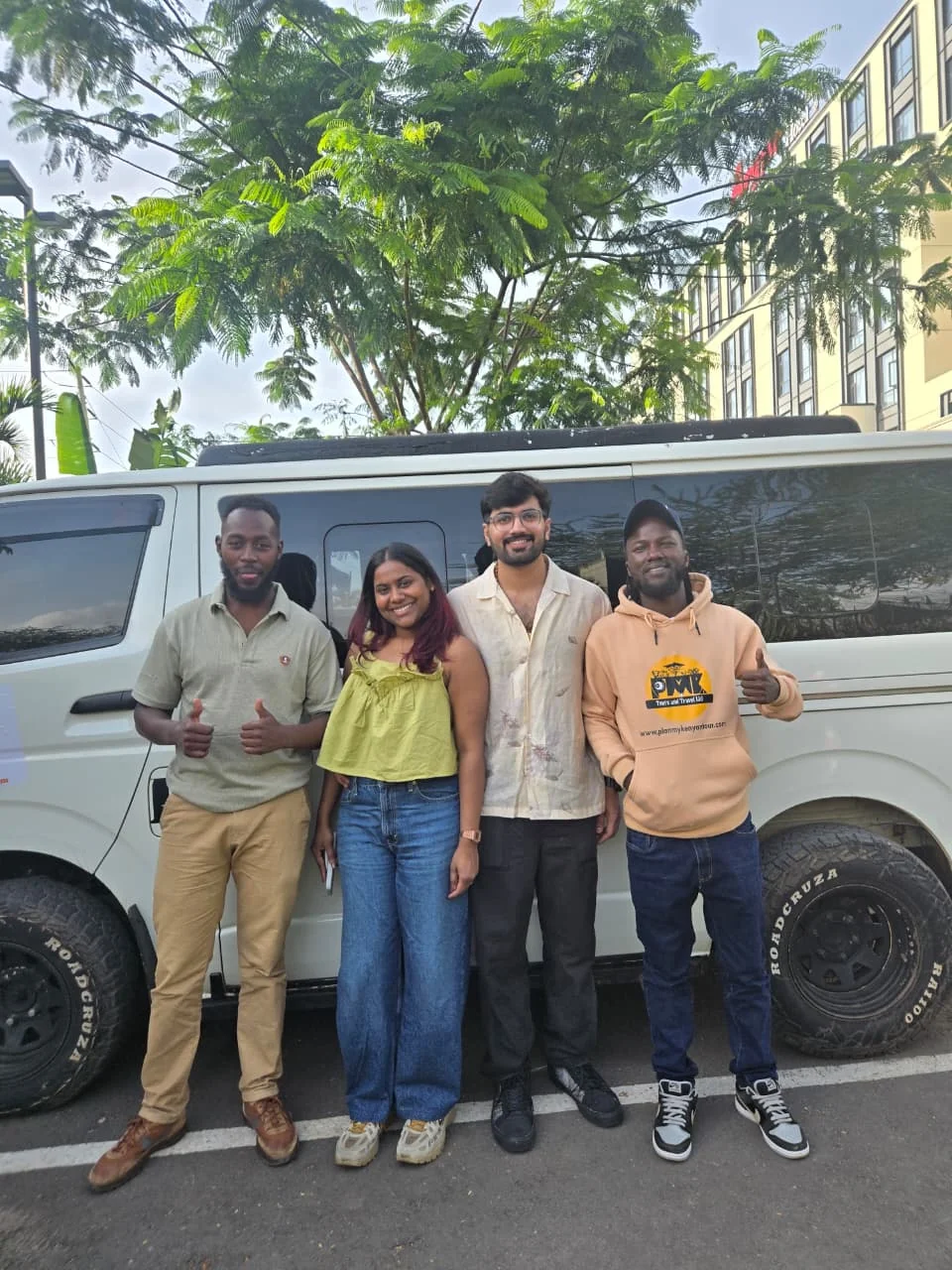 Travellers beside a PMK private safari vehicle