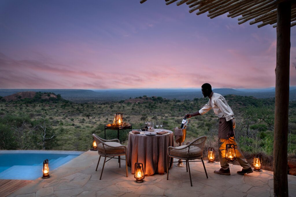Luxury bush dinner during a Kenya safari at sunset